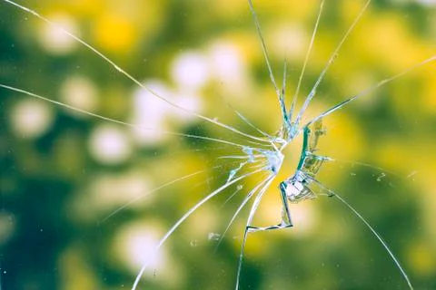 Broken green glass window Stock Photos