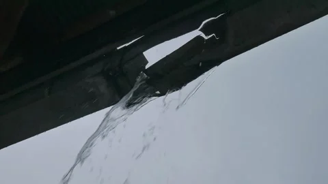 Broken gutter. House guttering leaking gallons of rain water flooding Stock Footage 141614001