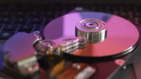Broken hard drive on notebook keyboard. Seamless looping of working process. Stock Footage 90460904