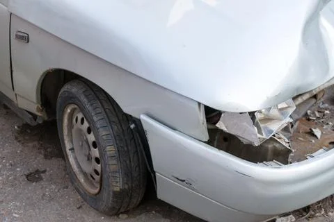 Broken Headlight on Silver Car Stock Photos