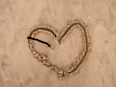 Broken heart on the beach Stock Photos