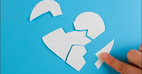 Broken heart on blue background. Stock Footage 117347295