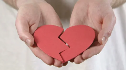 Broken heart held in hands Vídeo Stock 37622631