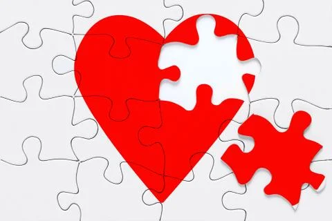 Broken heart jigsaw Stock Photos