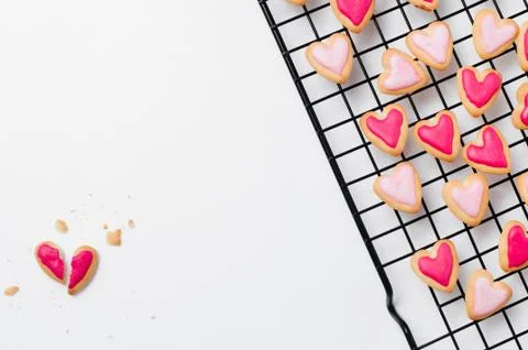 Broken heart shape cookie for Valentines Day on white background Stock Photos