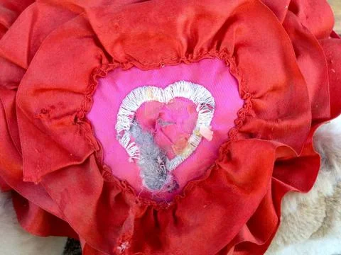Broken heart shape old and ripped torn stuffed toy Stock Photos