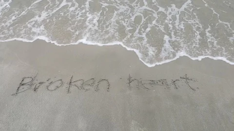 Broken heart word wash out Stock Footage