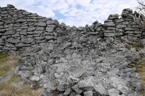 Broken high stone wall Stock Photos