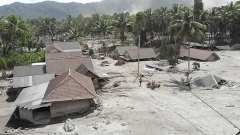 BROKEN HOUSE BECAUSE OF COLD LAVA IN RENTENG VILLAGE, LUMAJANG Stock Footage 166810220