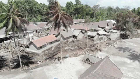 BROKEN HOUSE BECAUSE OF COLD LAVA IN RENTENG VILLAGE, LUMAJANG. Stock Footage 166810499