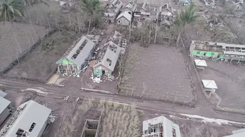 BROKEN HOUSE BECAUSE OF SEMERU MOUNTAIN ERUPTION IN CURAH KOBOKAN VILLAGE Stock Footage 166803155