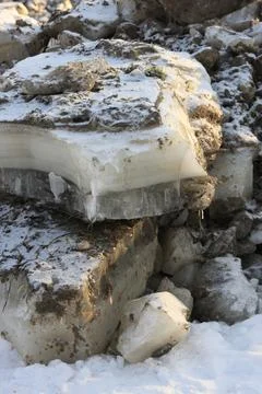 Broken ice blocks during winter lake cleaning. Stock Photos
