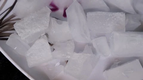 Broken Ice Cubes on White Plate 스톡 동영상 331621130