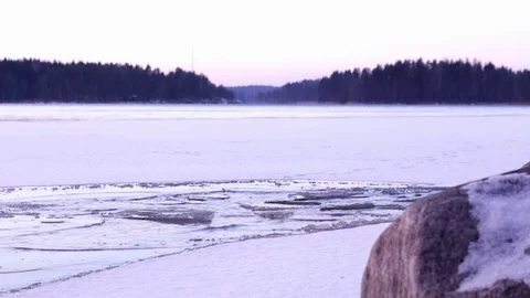 Broken ice floating in ice hole at a lake in early winter Stock Footage 70177044