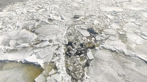 Broken ice floes float on the river Stock Footage 151347683