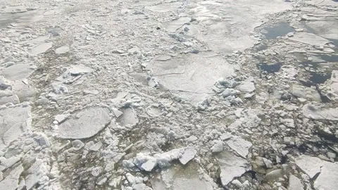 Broken ice floes float on the river Stock Footage 151347684
