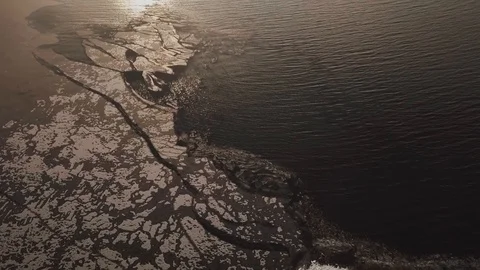 Broken ice floes floating at freezing lake in autumn Stock Footage 100567772