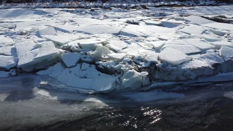 Broken ice stacked up on river Stock Footage 312062533
