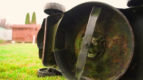 Broken lawn mower lying on the lawn, close-up Video stock 324697213