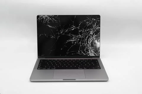 Broken LCD display on laptop computer. Isolated white background. Stock Photos