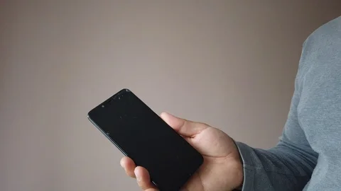 Broken LCD Display screen of black smartphone in hands of men Stock Footage 124742337