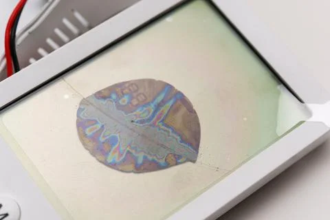 Broken LCD display showing cracks and colors across the surface Stock Photos