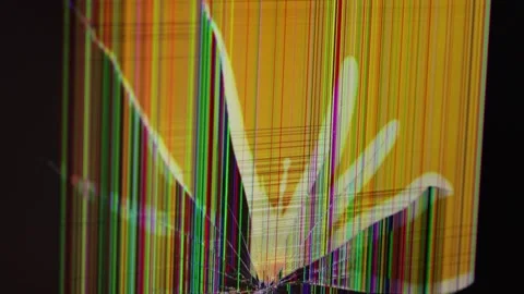 Broken LCD screen displaying colorful vertical glitch lines and shattered g.. Stock Footage 324964475