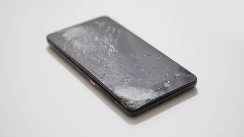 Broken LCD screen of the smartphone, faulty smartphone Stock Footage 70931927