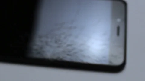 Broken LCD screen of the smartphone, faulty smartphone. arrival at the facility Stock Footage 98317363