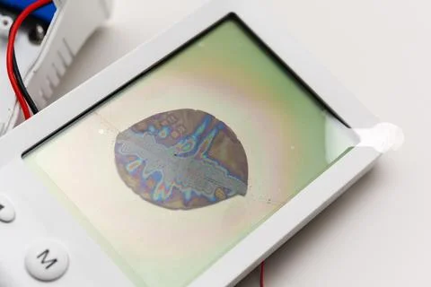 Broken LCD screen with visible damage and color distortions on display Stock Photos