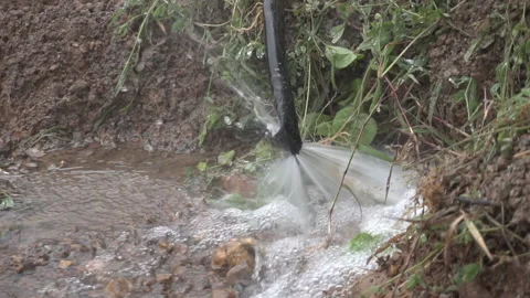Broken leak water pipe busting with water leakage Stock Footage 155889864