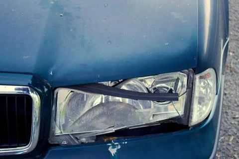 Broken Left Light on Dark Car. Stock Photos
