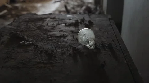A broken light bulb in an abandoned building among the ruins. Stock Footage 305753156