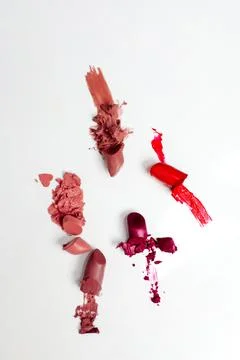 Broken lipstick make up isolated on white background Stock Photos