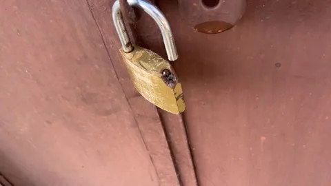 Broken Lock Hanging on Door | Old Rusty Padlock Close-Up Stock-Footage 318395565