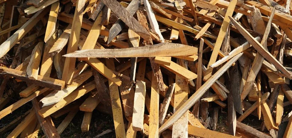 Broken long chunks of tree trunk. Close up broken pieces of wood. Pine timber Stock Photos