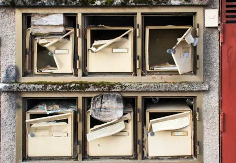 Broken mailboxes of an abandoned house. Stock Photos