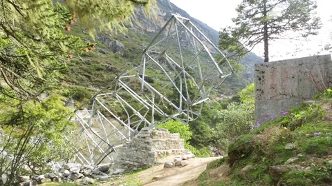 Broken metal structure partially blocking the path Stock Footage 77449757