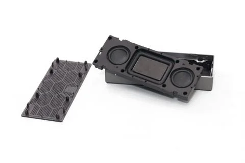 Broken mini bluetooth speaker on white background Stock Photos