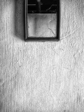 Broken mirror on an old wall. Stock Photos