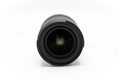 Broken mirrorless or DSLR camera lens isolated on white background Stock Photos