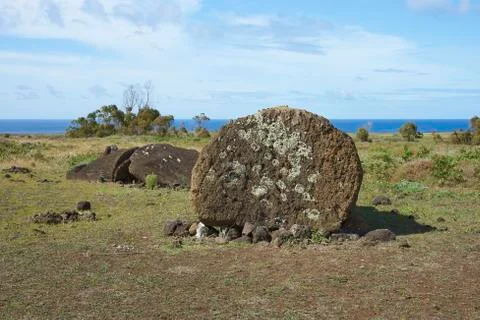 Broken Moai statue at the base of the extinct volcano Rano Raraku Stock Photos