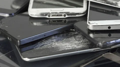 Broken Mobile Smart Phone and pad with crashed Screen Glass Lcd.  gadgets lyi Stock Footage 128328985