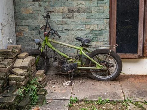 Broken motorized bicycle  Stock Photos