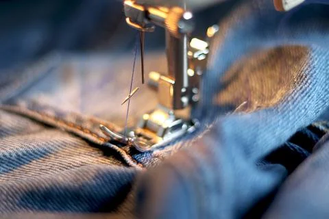 Broken needle in a sewing machine. The needle broke while sewing thick fabric Stock Photos