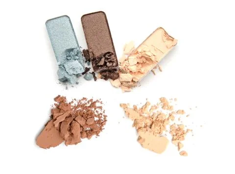 Broken neutral eye shadow make up trio isolated on a white background Stock Photos