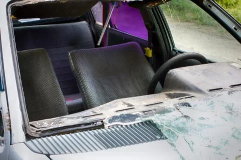 Broken old car with broken windshield. Stock Photos