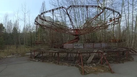 Broken old carousel in the city of Pripyat, Ukraine Stock Footage 74688057