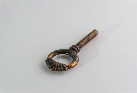 Broken old key on white background Stock Photos