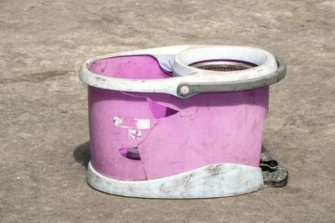 Broken old plastic mop bucket. Stock Photos